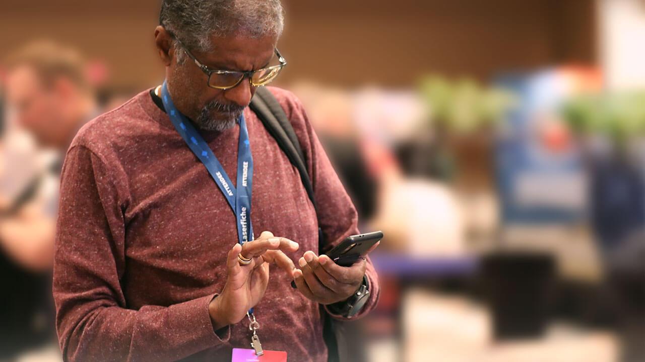 Empower attendee looking at the event app on their phone